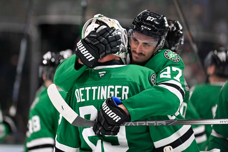 Oct 15, 2024; Dallas, Texas, USA; Dallas Stars goaltender Jake Oettinger (29) and left wing Mason Marchment (27) celebrate the Stars victory over the San Jose Sharks at the American Airlines Center. Mandatory Credit: Jerome Miron-Imagn ImagesOct 15, 2024; Dallas, Texas, USA; during the overtime shootout period at the American Airlines Center. Mandatory Credit: Jerome Miron-Imagn Images