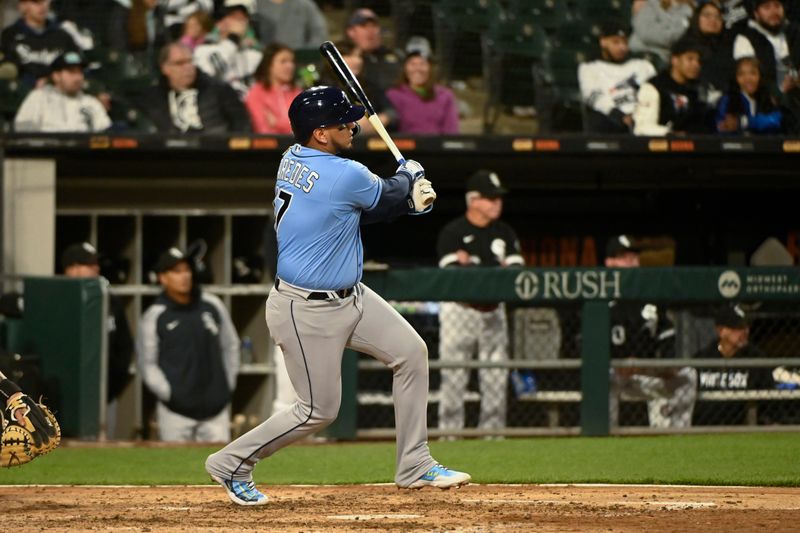 Apr 29, 2023; Chicago, Illinois, USA; Tampa Bay Rays third baseman Isaac Paredes (17) hits an RBI double against the Chicago White Sox during the seventh inning  at Guaranteed Rate Field. Mandatory Credit: Matt Marton-USA TODAY Sports