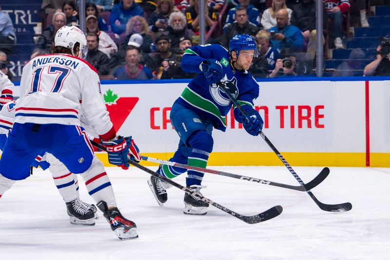 Mar 21, 2024; Vancouver, British Columbia, CAN; Vancouver Canucks forward Teddy Blueger (53) shoots against the Montreal Canadiens in the third period at Rogers Arena. Vancouver won 4 -1. Mandatory Credit: Bob Frid-USA TODAY Sports