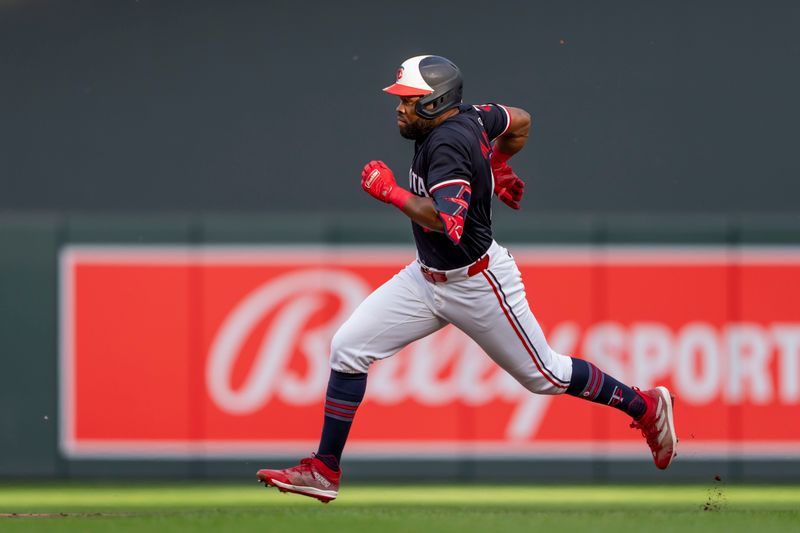 Jun 10, 2024; Minneapolis, Minnesota, USA; Minnesota Twins center fielder Manuel Margot (13) rounds second base after hitting a triple against the Colorado Rockies in the third inning at Target Field. Mandatory Credit: Jesse Johnson-USA TODAY Sports