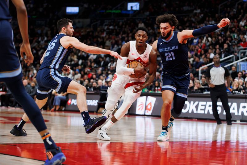 TORONTO, CANADA - JANUARY 22: RJ Barrett #9 of the Toronto Raptors drives the lane against David Roddy #21 and John Konchar #46 of the Memphis Grizzlies in the first half at Scotiabank Arena on January 22, 2024 in Toronto, Canada. NOTE TO USER: User expressly acknowledges and agrees that, by downloading and or using this photograph, User is consenting to the terms and conditions of the Getty Images License Agreement. (Photo by Cole Burston/Getty Images)