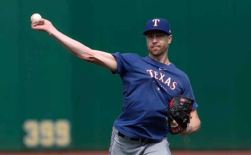 May 23, 2023; Pittsburgh, Pennsylvania, USA; Texas Rangers pitcher Jacob deGrom (48) throws in the outfield before the game against the Pittsburgh Pirates at PNC Park. Mandatory Credit: Charles LeClaire-USA TODAY Sports