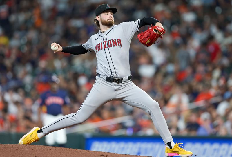 Sep 8, 2024; Houston, Texas, USA; Arizona Diamondbacks starting pitcher Ryne Nelson (19) delivers a pitch during the third inning against the Houston Astros at Minute Maid Park. Mandatory Credit: Troy Taormina-Imagn Images