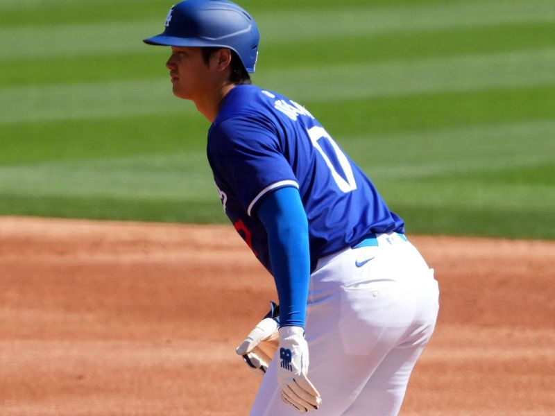 Mar 10, 2024; Phoenix, Arizona, USA; Los Angeles Dodgers designated hitter Shohei Ohtani (17) leads off first base against the Arizona Diamondbacks against the Arizona Diamondbacks during the first inning at Camelback Ranch-Glendale. Mandatory Credit: Joe Camporeale-USA TODAY Sports