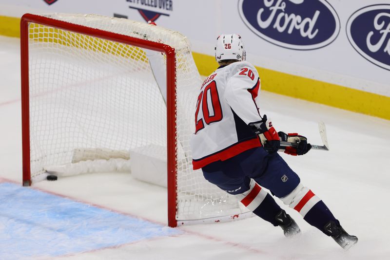 Nov 25, 2024; Sunrise, Florida, USA; Washington Capitals center Lars Eller (20) scores a goal on an empty net against the Florida Panthers during the third period at Amerant Bank Arena. Mandatory Credit: Sam Navarro-Imagn Images