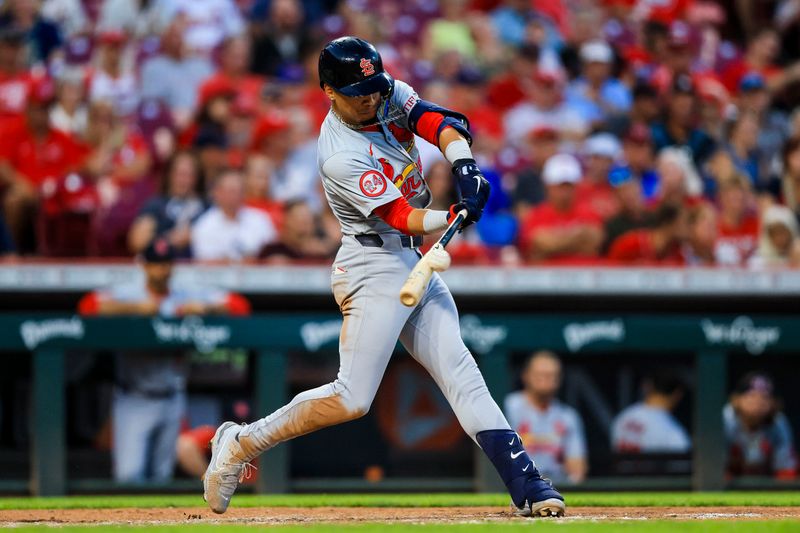 Aug 14, 2024; Cincinnati, Ohio, USA; St. Louis Cardinals shortstop Masyn Winn (0) hits a double in the sixth inning against the Cincinnati Reds at Great American Ball Park. Mandatory Credit: Katie Stratman-USA TODAY Sports