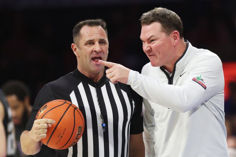 Jan 5, 2023; Tucson, Arizona, USA; Arizona Wildcats head coach Tommy Lloyd talks to the ref during the first half at McKale Center. Mandatory Credit: Zachary BonDurant-USA TODAY Sports