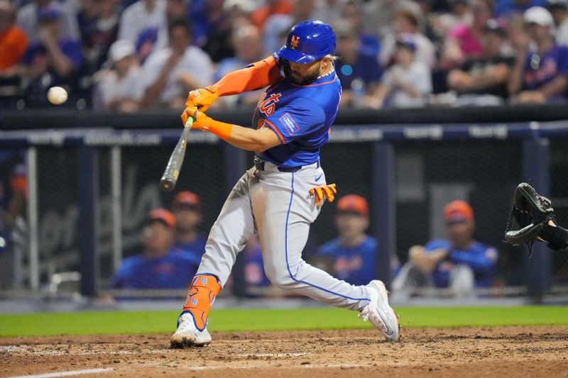Mar 16, 2024; West Palm Beach, Florida, USA;  New York Mets Yolmer Sanchez (83) hits a double in the sixth inning against the Houston Astros at CACTI Park of the Palm Beaches. Mandatory Credit: Jim Rassol-USA TODAY Sports