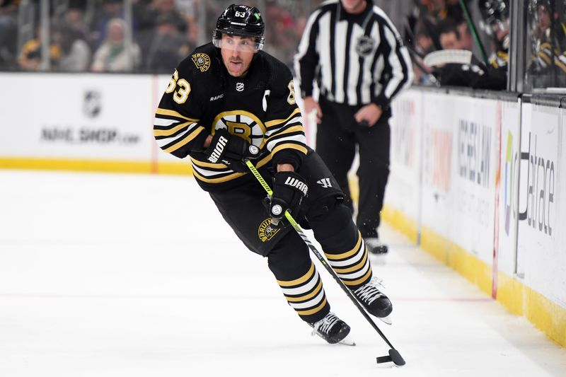 Mar 16, 2024; Boston, Massachusetts, USA; Boston Bruins left wing Brad Marchand (63) skates with the puck during the first period against the Philadelphia Flyers at TD Garden. Mandatory Credit: Bob DeChiara-USA TODAY Sports