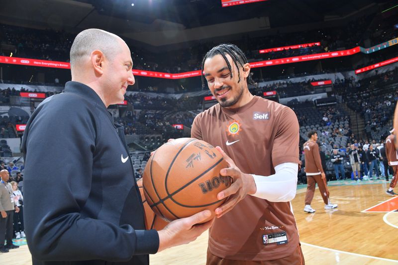 SAN ANTONIO, TX - MARCH 19: Tre Jones #33 of the San Antonio Spurs selects the game ball before the game against the Dallas Mavericks on March 19, 2024 at the Frost Bank Center in San Antonio, Texas. NOTE TO USER: User expressly acknowledges and agrees that, by downloading and or using this photograph, user is consenting to the terms and conditions of the Getty Images License Agreement. Mandatory Copyright Notice: Copyright 2024 NBAE (Photos by Michael Gonzales/NBAE via Getty Images)