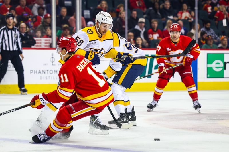 Jan 3, 2026; Calgary, Alberta, CAN; Nashville Predators left wing Michael Bunting (58) controls the puck against the Calgary Flames during the first period at Scotiabank Saddledome. Mandatory Credit: Sergei Belski-Imagn Images