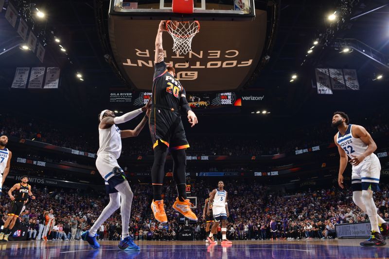 PHOENIX, AZ - APRIL 4: Jusuf Nurkic #20 of the Phoenix Suns drives to the basket during the game against the Minnesota Timberwolves during Round 1 Game 4 of the 2024 NBA Playoffs on April 4, 2023 at Footprint Center in Phoenix, Arizona. NOTE TO USER: User expressly acknowledges and agrees that, by downloading and or using this photograph, user is consenting to the terms and conditions of the Getty Images License Agreement. Mandatory Copyright Notice: Copyright 2024 NBAE (Photo by Barry Gossage/NBAE via Getty Images)