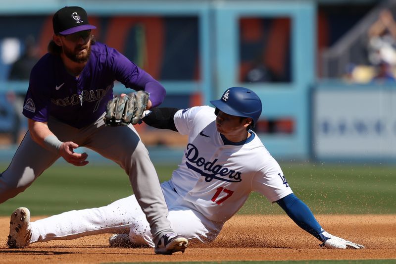 Sep 22, 2024; Los Angeles, California, USA;  Los Angeles Dodgers designated hitter Shohei Ohtani (17) steals second base during the third inning against the Colorado Rockies at Dodger Stadium. Mandatory Credit: Kiyoshi Mio-Imagn Images