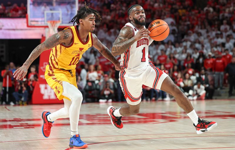 Feb 19, 2024; Houston, Texas, USA; Houston Cougars guard Jamal Shead (1) drives with the ball as Iowa State Cyclones guard Keshon Gilbert (10) defends during the second half at Fertitta Center. Mandatory Credit: Troy Taormina-USA TODAY Sports