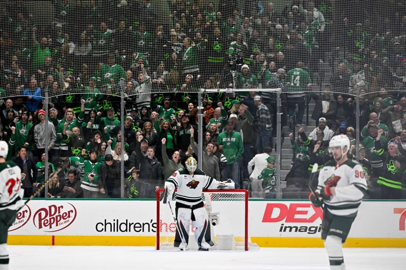 Jan 10, 2024; Dallas, Texas, USA; Minnesota Wild goaltender Jesper Wallstedt (30) looks down after he gives up a sixth goal to the Dallas Stars during the game at the American Airlines Center. Mandatory Credit: Jerome Miron-USA TODAY Sports