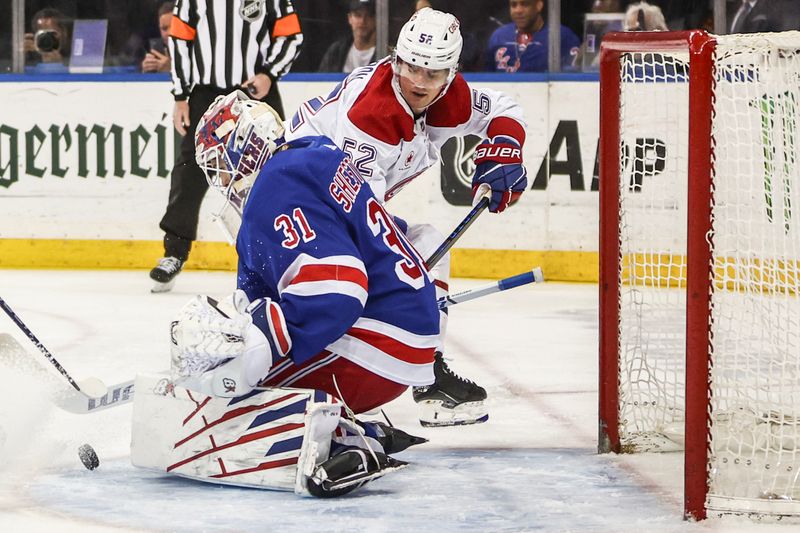 Apr 7, 2024; New York, New York, USA;  New York Rangers goaltender Igor Shesterkin (31) makes a save on a shot on goal attempt by Montreal Canadiens defenseman Justin Barron (52) in the first period at Madison Square Garden. Mandatory Credit: Wendell Cruz-USA TODAY Sports