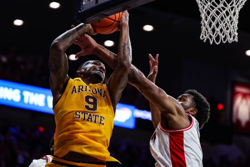 Mar 4, 2025; Tucson, Arizona, USA; Arizona Wildcats forward Tobe Awaka (30) fouls Arizona State Sun Devils center Shawn Philips Jr. (9) during the first half at McKale Center. Mandatory Credit: Aryanna Frank-Imagn Images