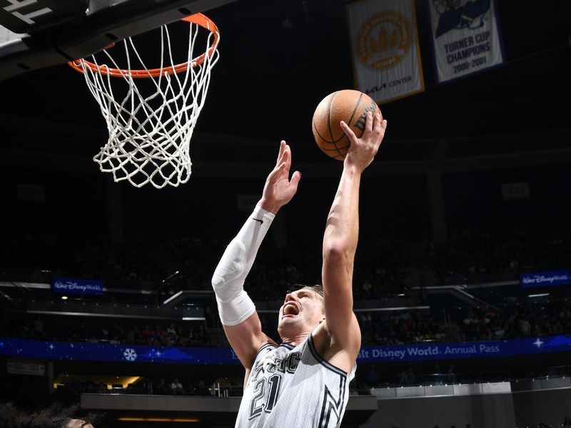 ORLANDO, FL - NOVEMBER 27: Moritz Wagner #21 of the Orlando Magic drives to the basket during the game against the Chicago Bulls on November 27, 2024 at Kia Center in Orlando, Florida. NOTE TO USER: User expressly acknowledges and agrees that, by downloading and or using this photograph, User is consenting to the terms and conditions of the Getty Images License Agreement. Mandatory Copyright Notice: Copyright 2024 NBAE (Photo by Fernando Medina/NBAE via Getty Images)