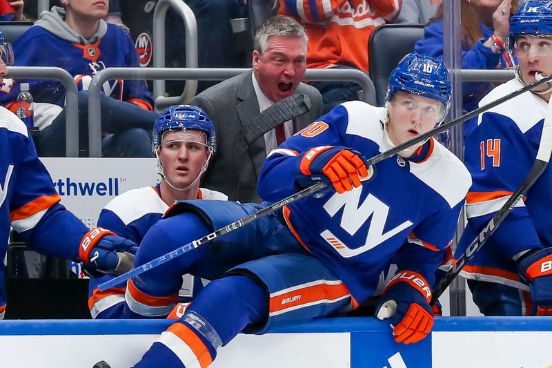 Apr 6, 2024; Elmont, New York, USA; New York Islanders head coach Patrick Roy directs right wing Simon Holmstrom (10) during the second period against the Nashville Predators at UBS Arena. Mandatory Credit: Tom Horak-USA TODAY Sports