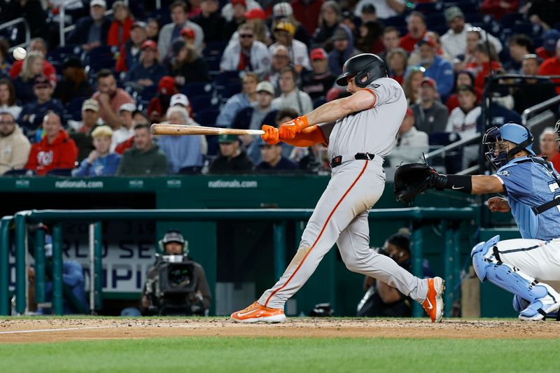 May 23, 2025; Washington, District of Columbia, USA; San Francisco Giants third base Matt Chapman (26) singles against the Washington Nationals during the eighth inning at Nationals Park. Mandatory Credit: Geoff Burke-Imagn Images
