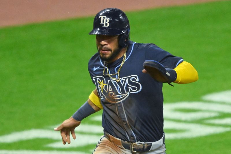 Sep 12, 2024; Cleveland, Ohio, USA; Tampa Bay Rays shortstop Jose Caballero (7) scores in the fourth inning against the Cleveland Guardians at Progressive Field. Mandatory Credit: David Richard-Imagn Images