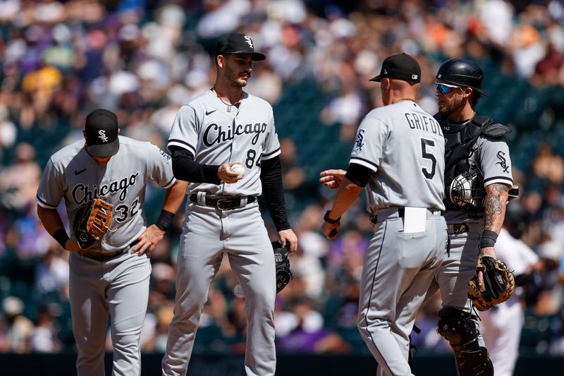 Aug 20, 2023; Denver, Colorado, USA; Chicago White Sox starting pitcher Dylan Cease (84) is pulled by manager Pedro Grifol (5) as first baseman Gavin Sheets (32) and catcher Yasmani Grandal (24) look on in the fifth inning against the Colorado Rockies at Coors Field. Mandatory Credit: Isaiah J. Downing-USA TODAY Sports