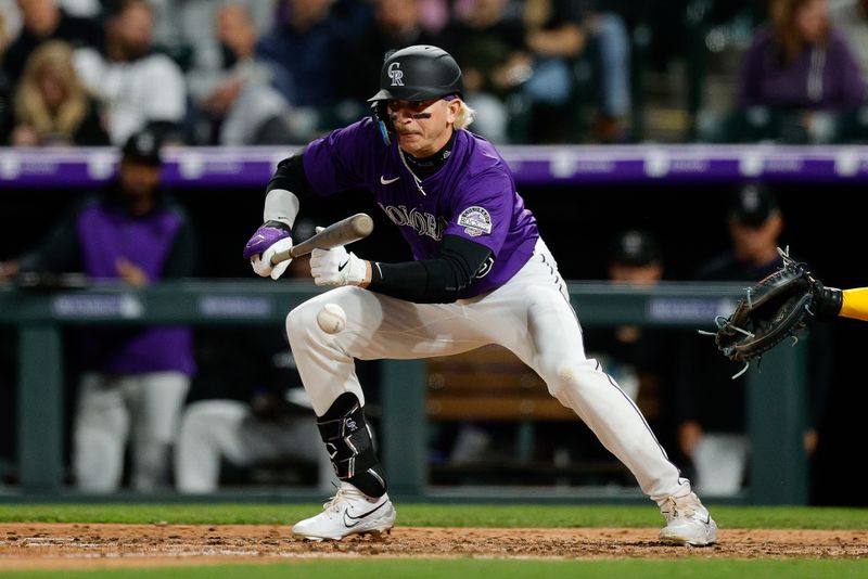 Apr 8, 2025; Denver, Colorado, USA; Colorado Rockies right fielder Zac Veen (13) bunts for his first career hit in the sixth inning against the Milwaukee Brewers at Coors Field. Mandatory Credit: Isaiah J. Downing-Imagn Images