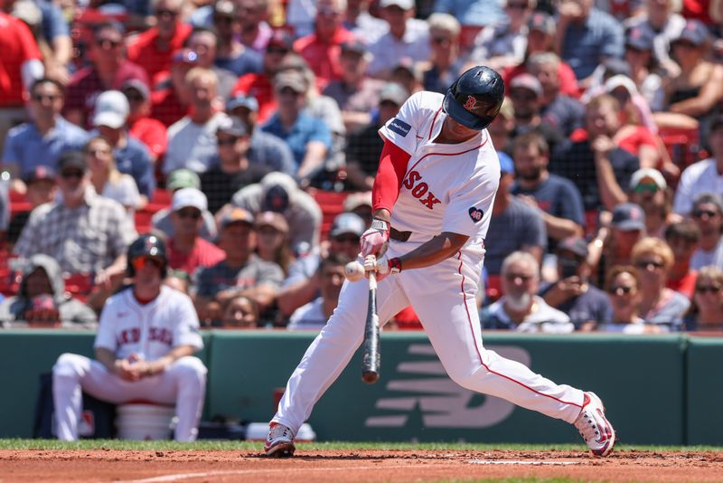 Jun 5, 2024; Boston, Massachusetts, USA; Boston Red Sox third baseman Rafael Devers (11) hits a solo home run during the second inning against the Atlanta Braves at Fenway Park. Mandatory Credit: Paul Rutherford-USA TODAY Sports