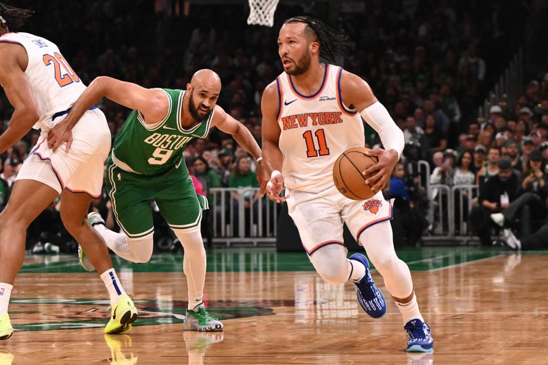 BOSTON, MASSACHUSETTS - OCTOBER 22: Jalen Brunson #11 of the New York Knicks brings the ball up the court against Derrick White #9 of the Boston Celtics during the first half at TD Garden on October 22, 2024 in Boston, Massachusetts. (Photo by Brian Fluharty/Getty Images)