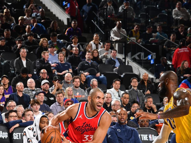 INGLEWOOD, CA - FEBRUARY 4: Nicolas Batum #33 of the LA Clippers handles the ball during the game against the Los Angeles Lakers on February 4, 2025 at Intuit Dome in Los Angeles, California. NOTE TO USER: User expressly acknowledges and agrees that, by downloading and/or using this Photograph, user is consenting to the terms and conditions of the Getty Images License Agreement. Mandatory Copyright Notice: Copyright 2025 NBAE (Photo by Juan Ocampo/NBAE via Getty Images)