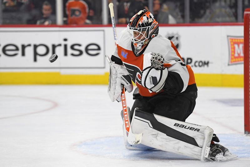 Nov 18, 2024; Philadelphia, Pennsylvania, USA; Philadelphia Flyers goaltender Aleksei Kolosov (35) makes a save against the Colorado Avalanche during the second period at Wells Fargo Center. Mandatory Credit: Eric Hartline-Imagn Images