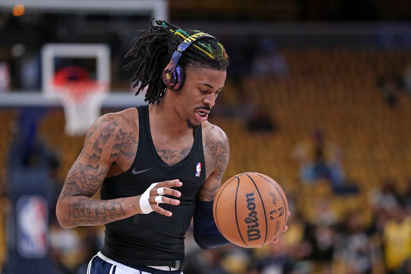 MEMPHIS, TENNESSEE - APRIL 16: Ja Morant #12 of the Memphis Grizzlies warms up before Game One of the Western Conference First Round Playoffs against the Los Angeles Lakers at FedExForum on April 16, 2023 in Memphis, Tennessee. NOTE TO USER: User expressly acknowledges and agrees that, by downloading and or using this photograph, User is consenting to the terms and conditions of the Getty Images License Agreement.  (Photo by Justin Ford/Getty Images)