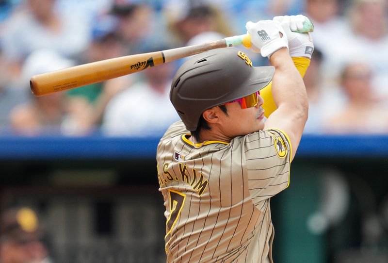 Jun 1, 2024; Kansas City, Missouri, USA; San Diego Padres shortstop Ha-Seong Kim (7) hits a three run double against the Kansas City Royals during the fourth inning at Kauffman Stadium. Mandatory Credit: Jay Biggerstaff-USA TODAY Sports