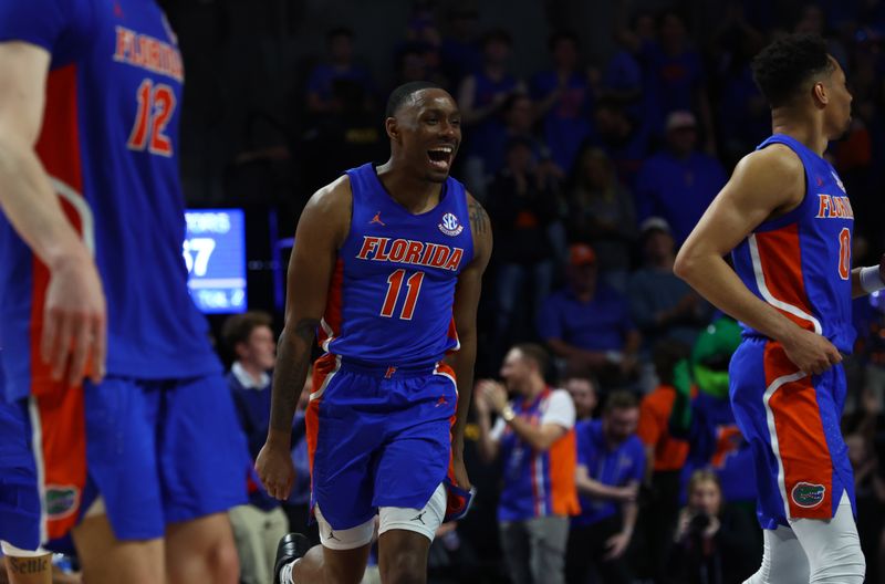 Feb 1, 2023; Gainesville, Florida, USA; Florida Gators guard Kyle Lofton (11) celebrates after a basket against the Tennessee Volunteers during the second half at Exactech Arena at the Stephen C. O'Connell Center. Mandatory Credit: Kim Klement-USA TODAY Sports