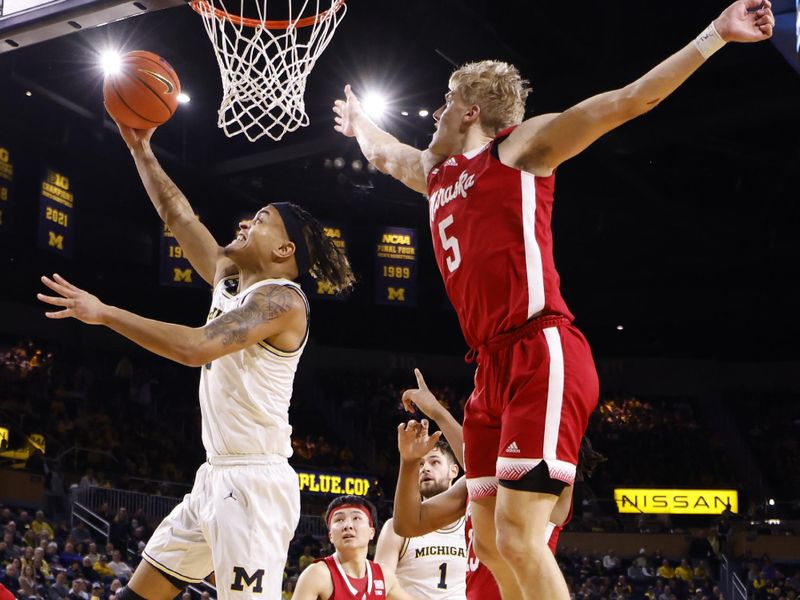 Feb 8, 2023; Ann Arbor, Michigan, USA;  Michigan Wolverines forward Terrance Williams II (5) shoots on Nebraska Cornhuskers guard Sam Griesel (5) in the first half at Crisler Center. Mandatory Credit: Rick Osentoski-USA TODAY Sports