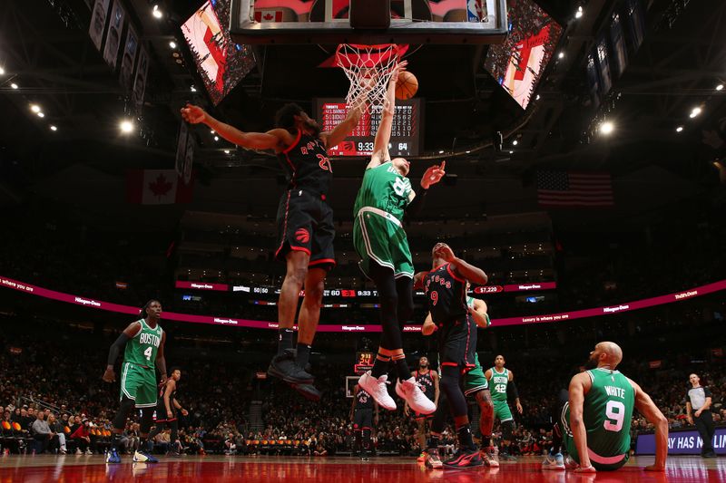 TORONTO, CANADA - JANUARY 15:  Kristaps Porzingis #8 of the Boston Celtics and Thaddeus Young #21 of the Toronto Raptors battle for a rebound on January 15, 2024 at the Scotiabank Arena in Toronto, Ontario, Canada.  NOTE TO USER: User expressly acknowledges and agrees that, by downloading and or using this Photograph, user is consenting to the terms and conditions of the Getty Images License Agreement.  Mandatory Copyright Notice: Copyright 2024 NBAE (Photo by Vaughn Ridley/NBAE via Getty Images)