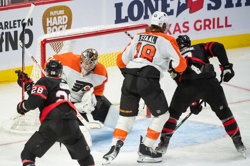 Oct 14, 2023; Ottawa, Ontario, CAN; Ottawa Senators right wing Claude Giroux (28) shoots on Philadelphia Flyers goalie Carter Hart (79) in the third period at the Canadian Tire Centre. Mandatory Credit: Marc DesRosiers-USA TODAY Sports