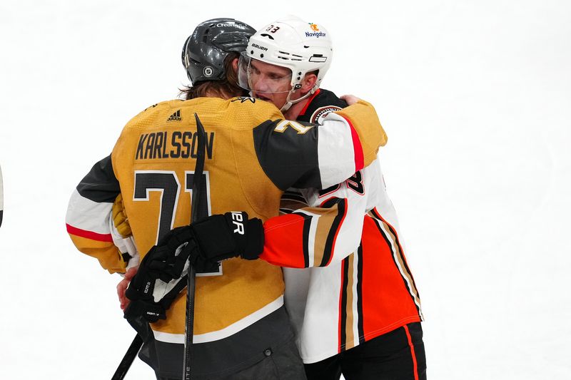 Apr 18, 2024; Las Vegas, Nevada, USA; Anaheim Ducks right wing Jakob Silfverberg (33) is embraced by Vegas Golden Knights center William Karlsson (71) after the Ducks defeated the Golden Knights 4-1 in the final game of his professional career at T-Mobile Arena. Mandatory Credit: Stephen R. Sylvanie-USA TODAY Sports