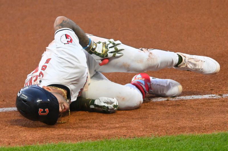 May 18, 2024; Cleveland, Ohio, USA; Cleveland Guardians shortstop Brayan Rocchio (4) reacts after tripping at first base in the seventh inning against the Minnesota Twins at Progressive Field. Mandatory Credit: David Richard-USA TODAY Sports