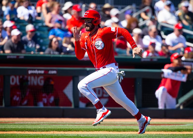 Mar 20, 2024; Goodyear, Arizona, USA; Cincinnati Reds base runner Jonathan India scores against the Texas Rangers during a spring training baseball game at Goodyear Ballpark. Mandatory Credit: Mark J. Rebilas-USA TODAY Sports