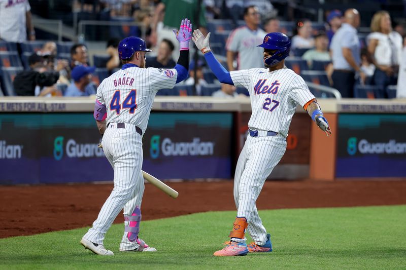 Jun 25, 2024; New York City, New York, USA; New York Mets third baseman Mark Vientos (27) celebrates his solo home run against the New York Yankees with center fielder Harrison Bader (44) during the fourth inning at Citi Field. Mandatory Credit: Brad Penner-USA TODAY Sports