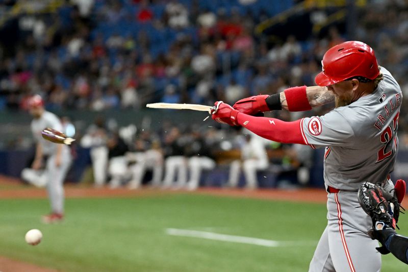 Jul 26, 2024; St. Petersburg, Florida, USA; Cincinnati Reds right fielder Jake Fraley (27) breaks his bat on a ground ball in the fourth inning against the Tampa Bay Rays at Tropicana Field. Mandatory Credit: Jonathan Dyer-USA TODAY Sports