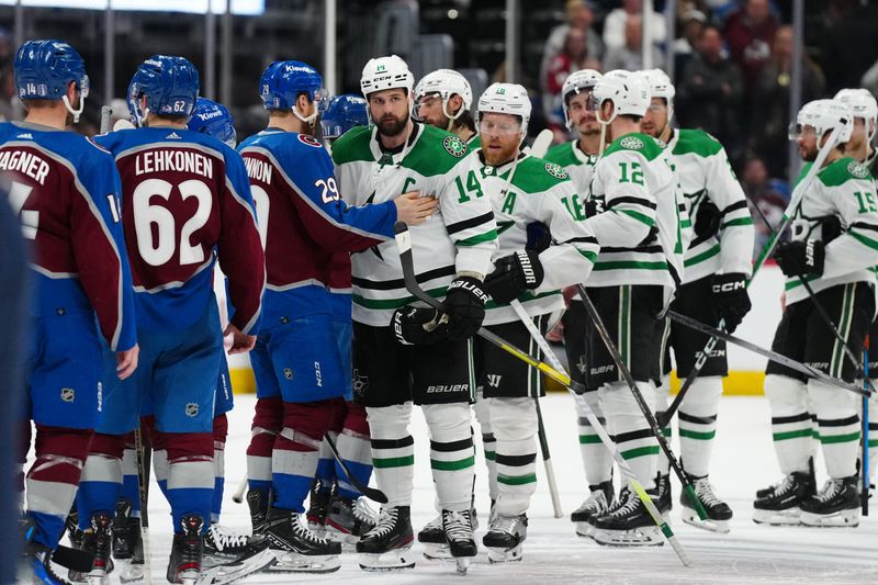 May 17, 2024; Denver, Colorado, USA; Dallas Stars left wing Jamie Benn (14) and Colorado Avalanche center Nathan MacKinnon (29) greet each other following a double overtime period in game six of the second round of the 2024 Stanley Cup Playoffs at Ball Arena. Mandatory Credit: Ron Chenoy-USA TODAY Sports