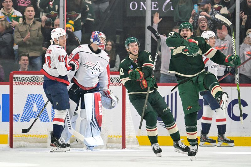 Jan 23, 2024; Saint Paul, Minnesota, USA;  Minnesota Wild forward Marcus Foligno (17) celebrates his goal against the Washington Capitals alongside forward Matt Boldy (12) during the first period at Xcel Energy Center. Mandatory Credit: Nick Wosika-USA TODAY Sports