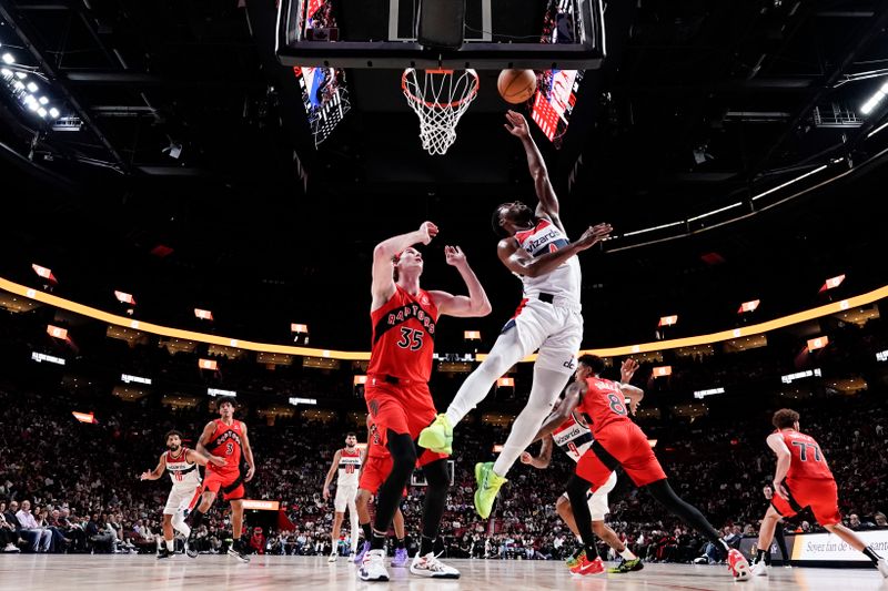 MONTREAL, CANADA - OCTOBER 6: Jared Butler #4 of the Washington Wizards shoots the ball during the game against the Toronto Raptors on October 6, 2024 at the Bell Centre in Montreal, Quebec, Canada.  NOTE TO USER: User expressly acknowledges and agrees that, by downloading and or using this Photograph, user is consenting to the terms and conditions of the Getty Images License Agreement.  Mandatory Copyright Notice: Copyright 2024 NBAE (Photo by Jordan Jones/NBAE via Getty Images)