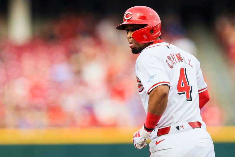 Jul 30, 2024; Cincinnati, Ohio, USA; Cincinnati Reds designated hitter Santiago Espinal (4) reacts after hitting a two-run home run in the second inning against the Chicago Cubs at Great American Ball Park. Mandatory Credit: Katie Stratman-USA TODAY Sports