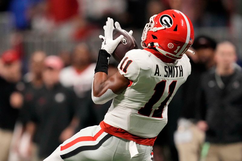 Dec 2, 2023; Atlanta, GA, USA; Georgia Bulldogs wide receiver Arian Smith (11) makes a catch against the Alabama Crimson Tide during the second half in the SEC Championship game at Mercedes-Benz Stadium. Mandatory Credit: Dale Zanine-USA TODAY Sports