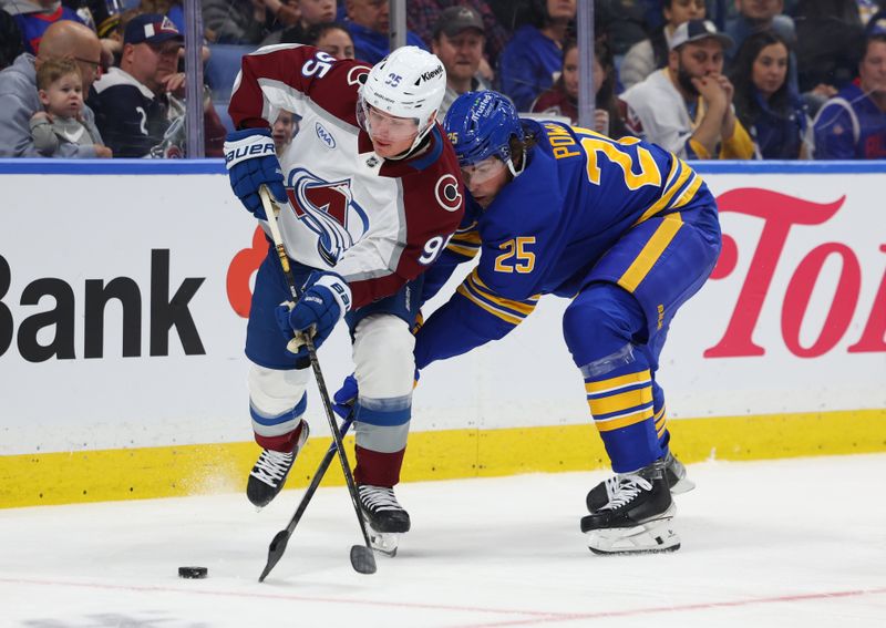 Oct 13, 2025; Buffalo, New York, USA;  Colorado Avalanche left wing Victor Olofsson (95) and Buffalo Sabres defenseman Owen Power (25) battle for a loose puck during the third period at KeyBank Center. Mandatory Credit: Timothy T. Ludwig-Imagn Images