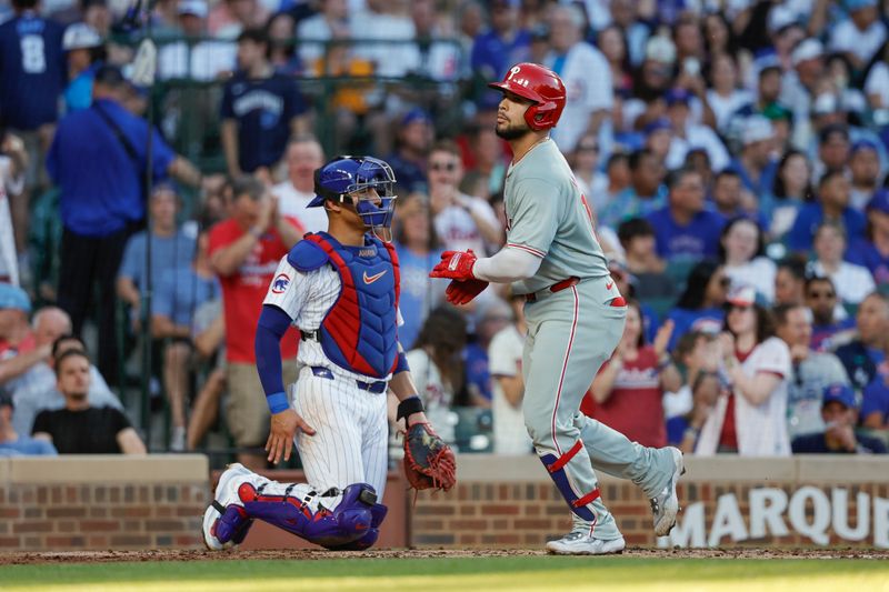 Jul 3, 2024; Chicago, Illinois, USA; Philadelphia Phillies catcher Rafael Marchan (13) crosses home plate after hitting a solo home run against the Chicago Cubs during the third inning at Wrigley Field. Mandatory Credit: Kamil Krzaczynski-USA TODAY Sports