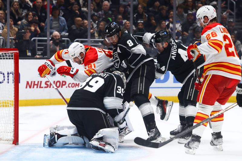 Dec 23, 2023; Los Angeles, California, USA; Los Angeles Kings goaltender Cam Talbot (39) makes a save against Calgary Flames center Nazem Kadri (91) during the third period of a game at Crypto.com Arena. Mandatory Credit: Jessica Alcheh-USA TODAY Sports